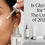 A clear drop of glycerin serum resting on a green botanical leaf, symbolizing pure, natural skin hydration.