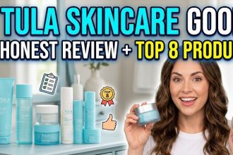 A collection of Tula Skincare products including the blue purifying face cleanser, eye balms, and moisture cream on a white marble surface.